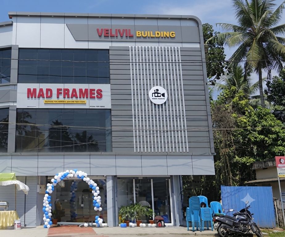 The MAD Frames shop in Haripad, with the red MAD FRAMES signboard on the building front